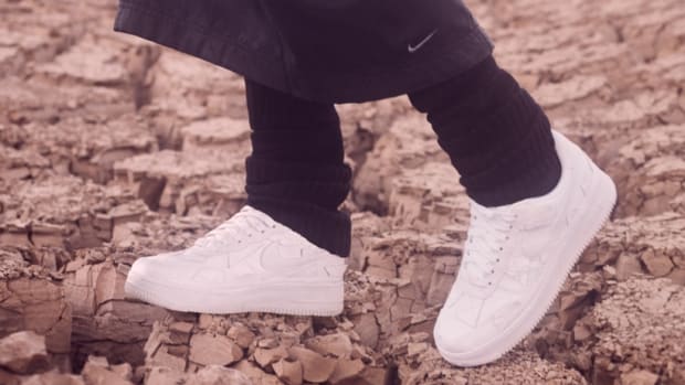 View of white Nike Air Force shoes.
